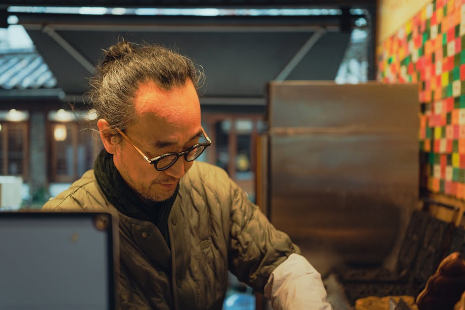 Candid portrait of a Korean vendor working at an outdoor market in Seoul, South Korea.